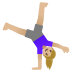 woman cartwheeling, medium-light skin tone